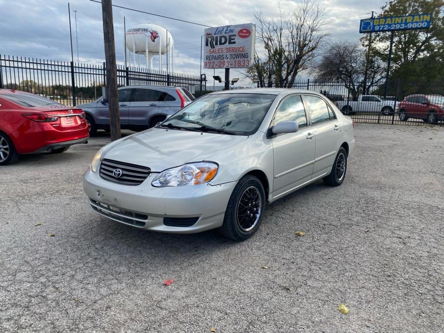 2004 SILVER TOYOTA COROLLA CE (1NXBR32EX4Z) with an 1.8L engine, Automatic transmission, located at 1507 S Hwy 67, Cedar Hill, TX, 75104, (972) 293-1833, 32.556370, -96.973297 - Photo#0