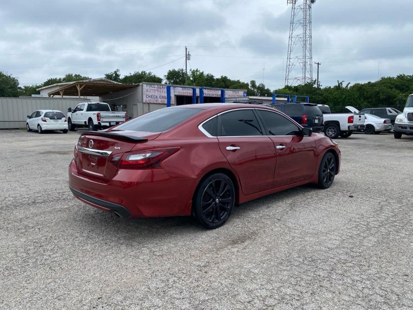 2017 RED NISSAN ALTIMA 2.5 (1N4AL3AP0HC) with an 2.5L engine, Continuously Variable transmission, located at 1507 S Hwy 67, Cedar Hill, TX, 75104, (972) 293-1833, 32.556370, -96.973297 - Photo#2