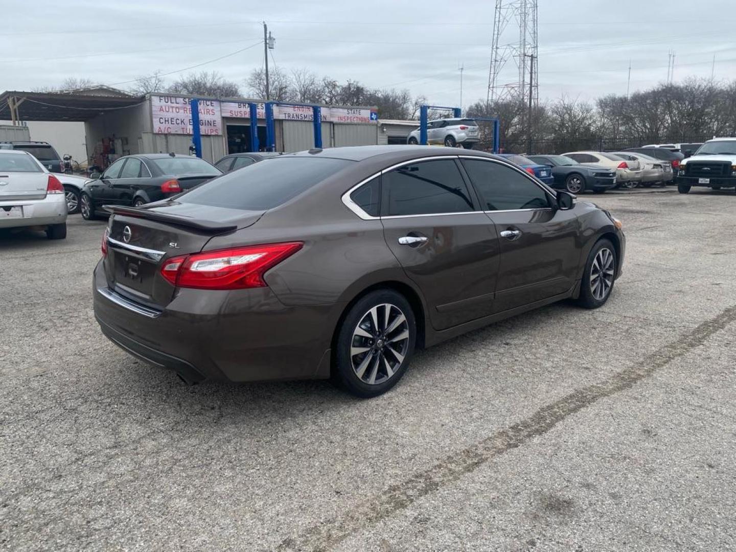 2016 BROWN NISSAN ALTIMA 2.5 (1N4AL3AP6GC) with an 2.5L engine, Continuously Variable transmission, located at 1507 S Hwy 67, Cedar Hill, TX, 75104, (972) 293-1833, 32.556370, -96.973297 - Photo#2